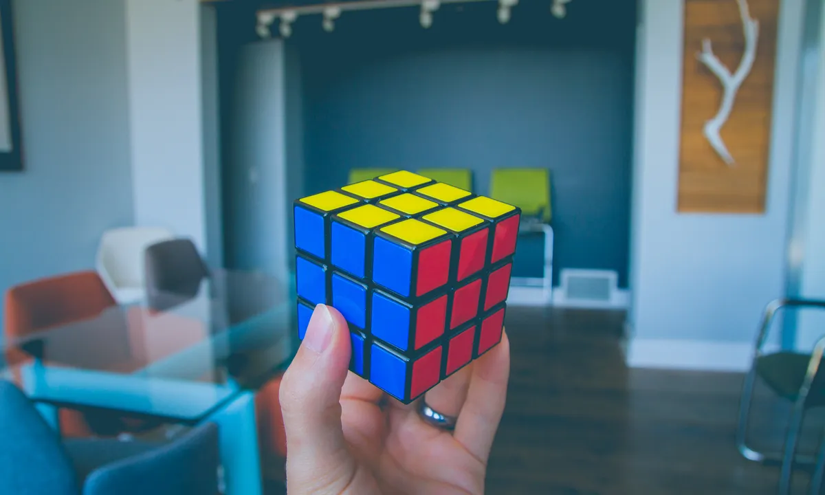 A Rubik's cube, representing a solution being solved piece by piece